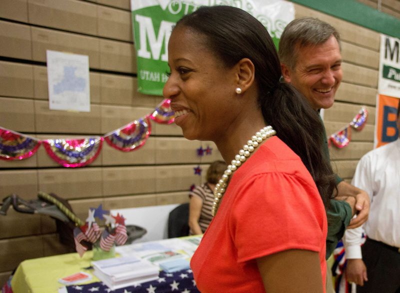 FILE PHOTO: Mia Love, mayor of Saratoga Springs and Republican candidate in Utah's 4th Congressional District, smiles as she walks past Democratic Rep. Jim Matheson at a community event in Salt Lake City, Utah, May 14, 2012. REUTERS/Jim Urquhart/File Photo