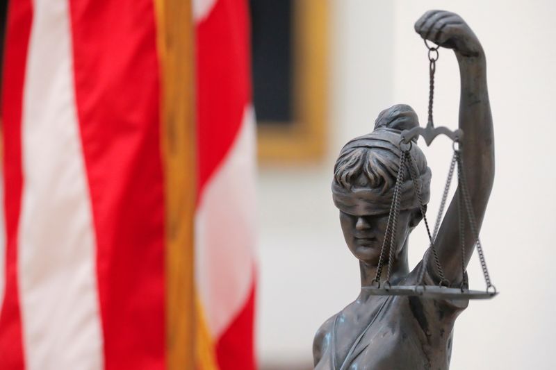 FILE PHOTO: A Lady Justice statue is seen at the Delaware Supreme Court in Dover, Delaware, U.S., June 10, 2021. REUTERS/Andrew Kelly/File Photo