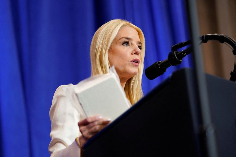 FILE PHOTO: U.S. Attorney General Pam Bondi speaks during U.S. President Donald Trump's visit to the Department of Justice to address its workers, in Washington, D.C., U.S., March 14, 2025. REUTERS/Nathan Howard/File Photo