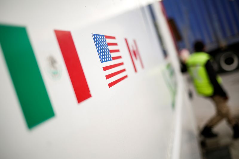 FILE PHOTO: Flags of Mexico, United States and Canada are pictured at a security booth at Zaragoza-Ysleta border crossing bridge, in Ciudad Juarez, Mexico January 16, 2020. REUTERS/Jose Luis Gonzalez/File Photo
