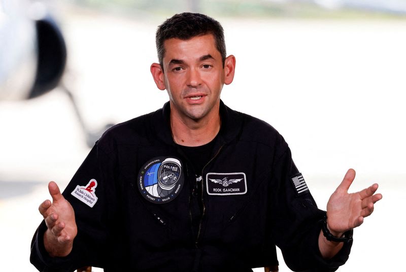 FILE PHOTO: Commander Jared Isaacman of Polaris Dawn, a private human spaceflight mission, speaks at a press conference at the Kennedy Space Center in Cape Canaveral, Florida, U.S. August 19, 2024. Launch aboard a SpaceX Falcon 9 rocket is scheduled for August 26. REUTERS/Joe Skipper/File Photo