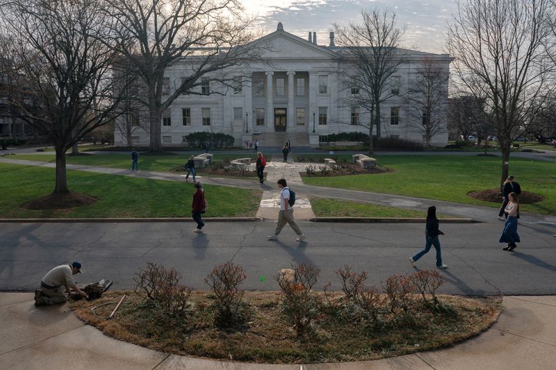 Students walk through the campus of American University in Washington, D.C., U.S., March 20, 2025. REUTERS/Nathan Howard/File Photo