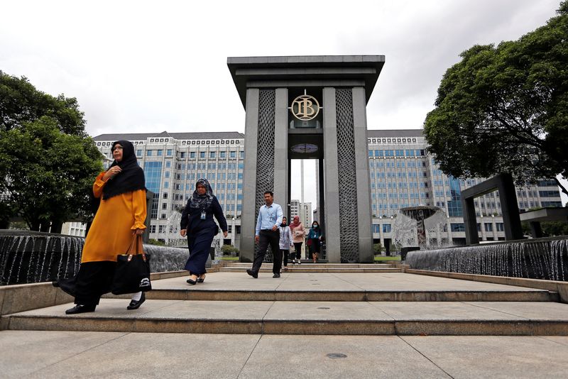FILE PHOTO: Visitors walk as they leave Bank Indonesia headquarters in Jakarta, Indonesia, January 17, 2019. REUTERS/Willy Kurniawan/File photo