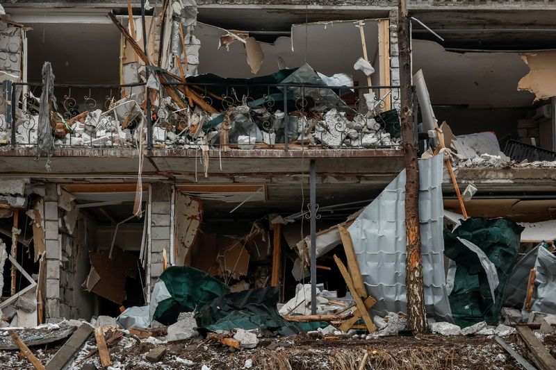 View shows damaged private houses at a site of a Russian drone strike, amid Russia's attack on Ukraine, in the town of Hostomel, Kyiv region, Ukraine March 19, 2025. REUTERS/Alina Smutko