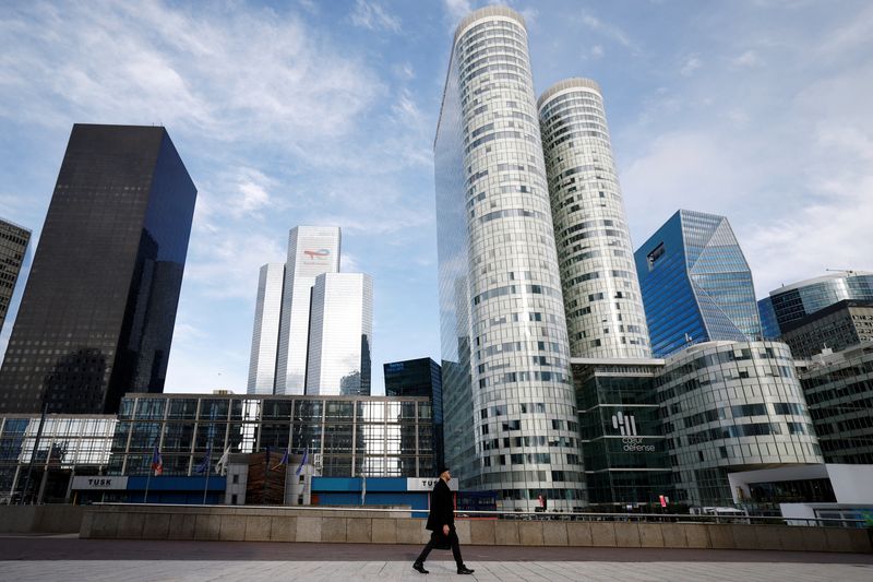 FILE PHOTO: A man walks on the esplanade of La Defense in the financial and business district of La Defense, near Paris, France, January 27, 2025. REUTERS/Sarah Meyssonnier/File Photo