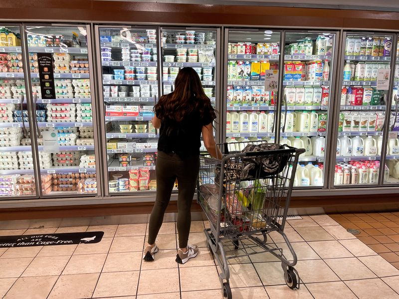 FILE PHOTO: A woman shops in a supermarket as rising inflation affects consumer prices in Los Angeles, California, U.S., June 13, 2022. REUTERS/Lucy Nicholson/File Photo