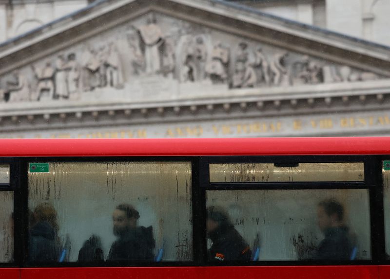 Commuters ride on a bus during the morning rush hour near the Bank of England in the City of London financial district in London, Britain, February 8, 2024. REUTERS/Toby Melville/File Photo