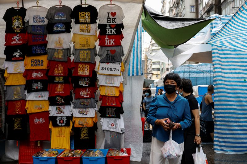 People walk at the Ladies’ Market, a popular tourist attraction, in Mongkok, Hong Kong
