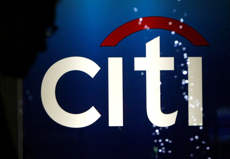 FILE PHOTO: A man walks past a logo of Citigroup Inc in Tokyo February 3, 2009. REUTERS/Yuriko Nakao(JAPAN)/File Photo