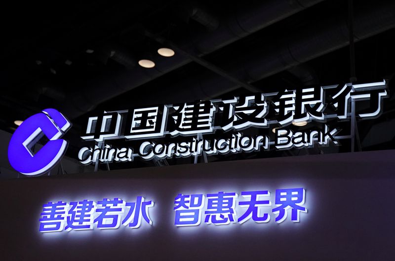 FILE PHOTO: A sign of China Construction Bank is seen at its booth at the 2020 China International Fair for Trade in Services (CIFTIS) in Beijing, China September 4, 2020. REUTERS/Tingshu Wang/File Photo