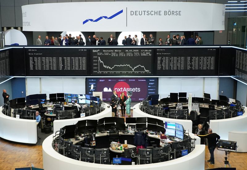 FILE PHOTO: German share price index DAX graph is pictured at the stock exchange in Frankfurt, Germany, March 26, 2025.    REUTERS/Staff/File Photo