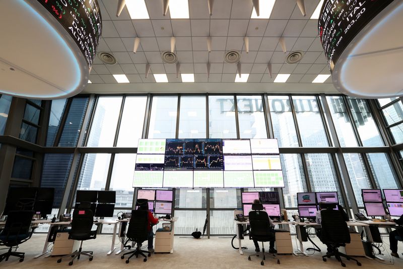 FILE PHOTO: People work at the trading floor of the Euronext stock exchange in the La Defense business district in Paris, France, March 10, 2025. REUTERS/Benoit Tessier/File Photo
