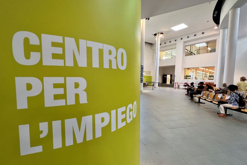 FILE PHOTO: People wait at an employment centre in Milan, Italy June 14, 2022. REUTERS/Flavio Lo Scalzo/File Photo
