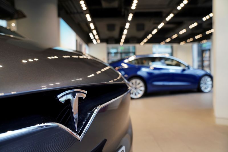 FILE PHOTO: A Tesla logo is seen at a Tesla showroom in Shanghai, China January 7, 2019. REUTERS/Aly Song/File Photo