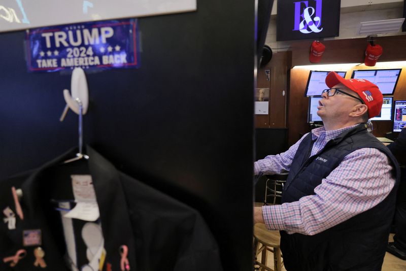 Traders work on NYSE floor