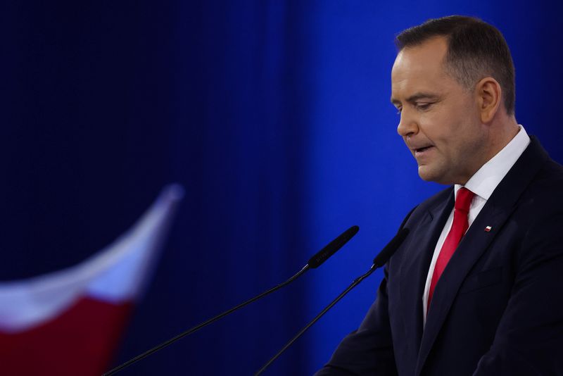 FILE PHOTO: Karol Nawrocki, a candidate for Polish presidential election in 2025 supported by Poland's main opposition party Law and Justice (PiS), reacts during an election convention in Szeligi, Poland, March 2, 2025. REUTERS/Kacper Pempel/File Photo