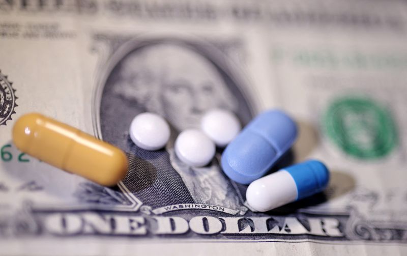 U.S. dollar banknote and medicines are seen in this illustration taken, June 27, 2024. REUTERS/Dado Ruvic/Illustration/File Photo