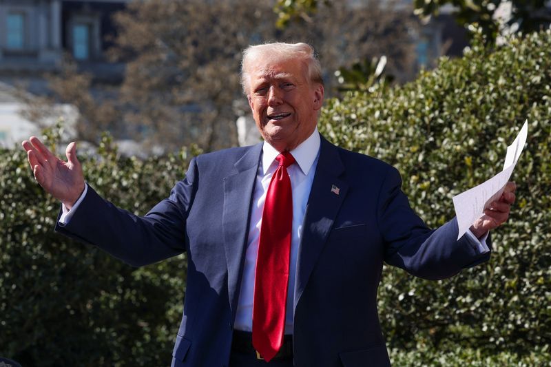 U.S. President Donald Trump views a Tesla car at the White House in Washington
