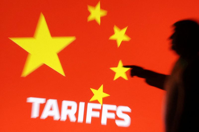 FILE PHOTO: A 3D-printed miniature model depicting U.S. President Donald Trump, Chinese flag  and word "Tariffs" in this illustration taken,  April 17, 2025. REUTERS/Dado Ruvic/Illustration/File Photo