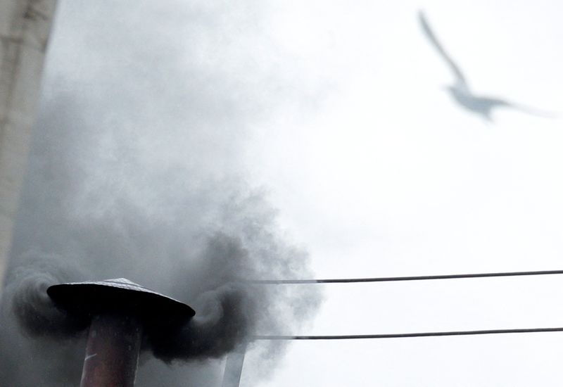 FILE PHOTO: Black smoke rises from the chimney on the Sistine Chapel in Saint Peter's Square, indicating no decision has been made after the first voting session on the second day of the election of a new pope, at the Vatican, March 13, 2013. REUTERS/Max Rossi/File Photo