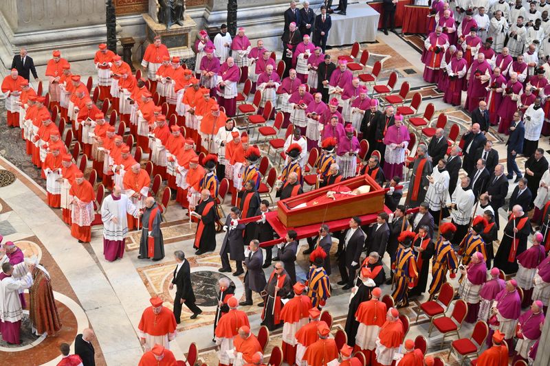 The coffin with the body of Pope Francis is carried into St. Peter's Basilica, where he will lie in state, at the Vatican, April 23, 2025.  ALESSANDRO DI MEO/Pool via REUTERS