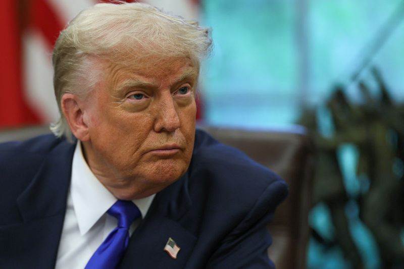 FILE PHOTO: U.S. President Donald Trump looks on as he signs executive orders and proclamations in the Oval Office at the White House, in Washington, D.C., U.S., May 5, 2025. REUTERS/Leah Millis/File Photo