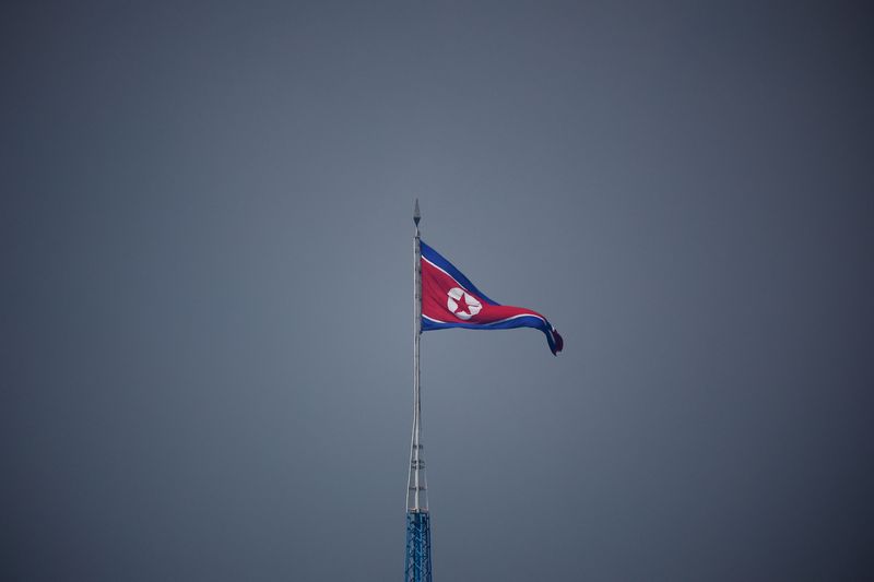 FILE PHOTO: A North Korean flag flutters at the propaganda village of Gijungdong in North Korea, in this picture taken near the truce village of Panmunjom inside the demilitarized zone (DMZ) separating the two Koreas, South Korea, July 19, 2022. REUTERS/Kim Hong-Ji/Pool/File Photo