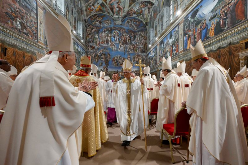 Pope Leo XIV walks in the Sistine Chapel at the Vatican, May 9, 2025.  Vatican Media/Francesco Sforza ­Handout via REUTERS