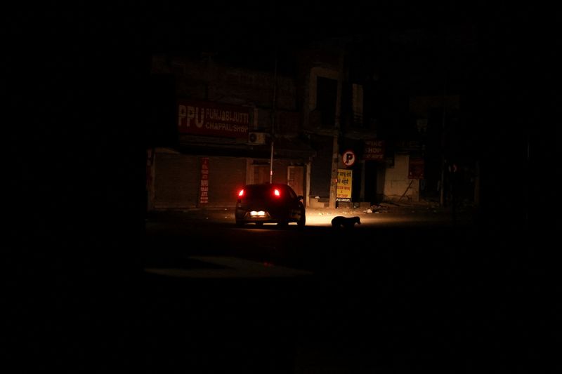A car moves during a blackout in the city of Amritsar, India, May 9, 2025 REUTERS/Francis Mascarenhas