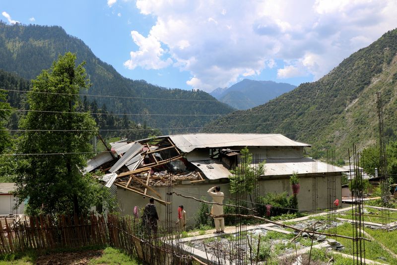 Residents inspect the damage to a house in Shahkot Village, Neelum Valley, Pakistani Kashmir, May 13, 2025. REUTERS/Stringer