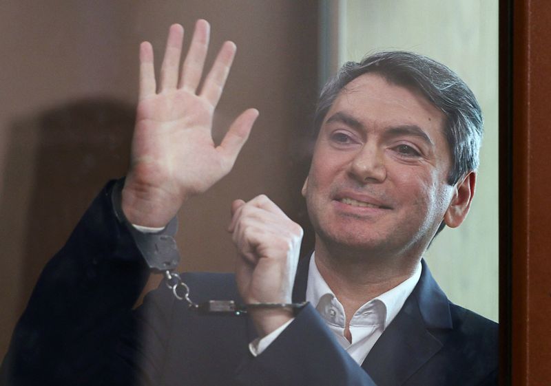 Grigory Melkonyants, the co-chair of Russia's election monitoring group Golos (Voice), who is accused of cooperating with an "undesirable organisation", reacts inside an enclosure for defendants during a court hearing in Moscow, Russia May 14, 2025. REUTERS/Evgenia Novozhenina