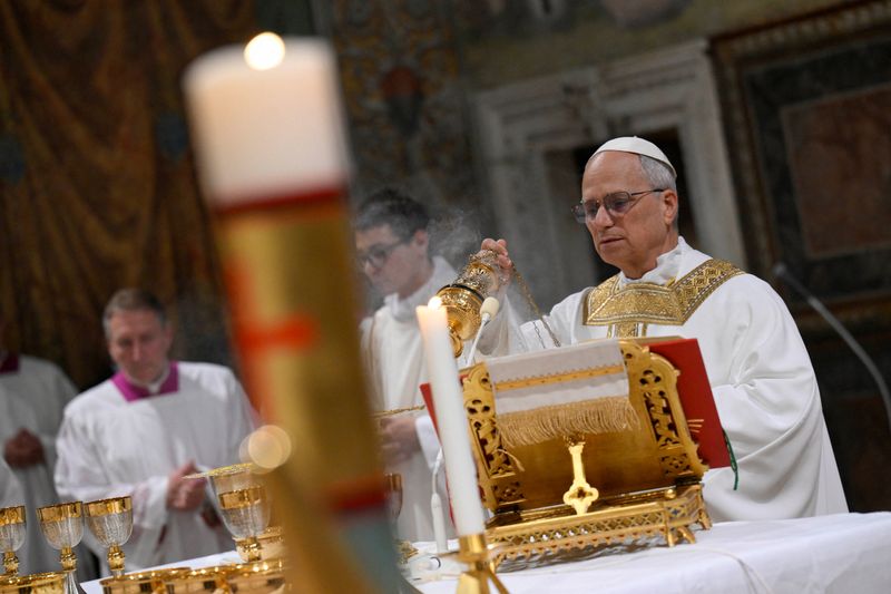 FILE PHOTO: Pope Leo XIV conducts Mass in the Sistine Chapel at the Vatican, May 9, 2025. Vatican Media/Handout via REUTERS/File Photo