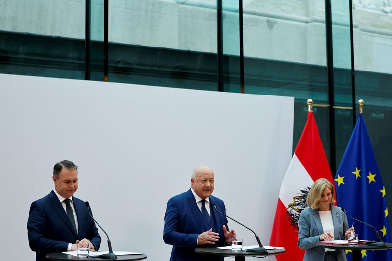 Austrian centrist parties give a press statement after finalizing coalition talks, in Vienna