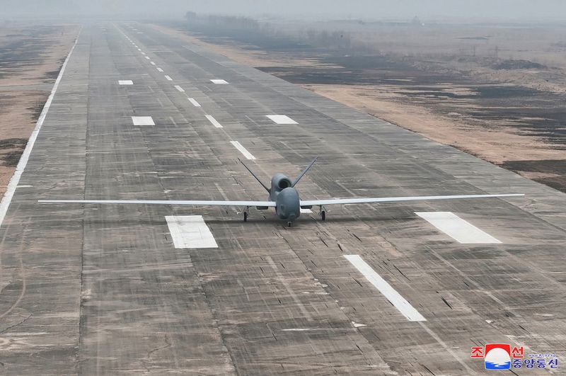 A suicide drone equipped with artificial intelligence (AI) technology is pictured on a runway, on the day North Korean leader Kim Jong Un guides defense science research projects, according to local media, at an unknown location, in this photo released by North Korea's official Korean Central News Agency on March 27, 2025.    KCNA via REUTERS