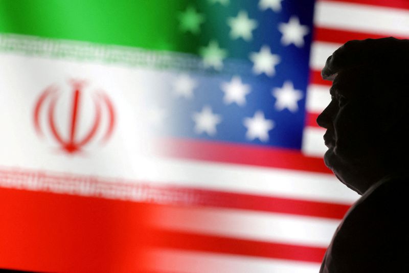 FILE PHOTO: A 3D-printed miniature model of Donald Trump and the U.S. and Iran flags are seen in this illustration taken January 15, 2025. REUTERS/Dado Ruvic/Illustration/File Photo