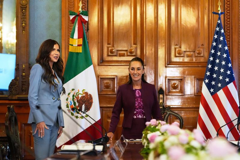 U.S. Homeland Security Secretary Kristi Noem, left, arrives to meet with Mexican President Claudia Sheinbaum at the National Palace in Mexico City, Friday, March 28, 2025. Alex Brandon/Pool via REUTERS
