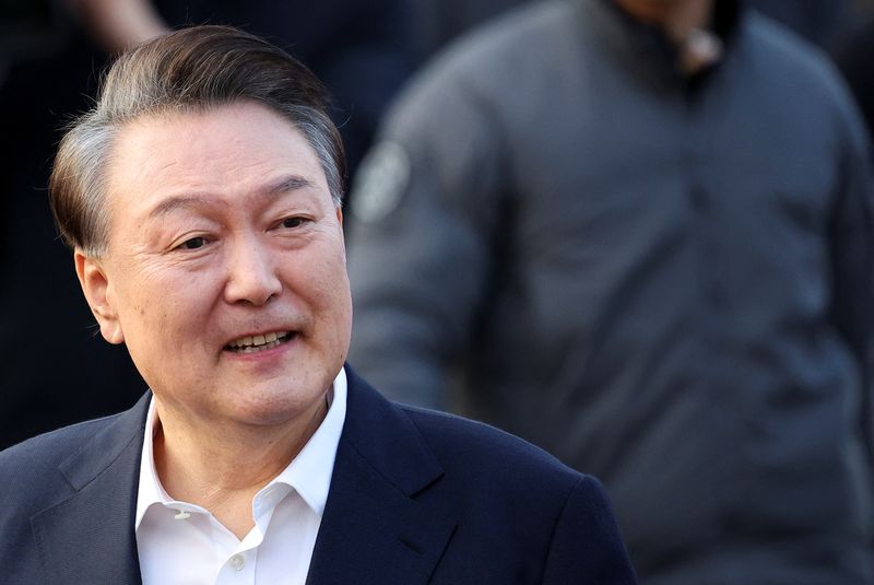 FILE PHOTO: South Korean impeached President Yoon Suk Yeol reacts outside the Seoul detention center after his release, in Uiwang, South Korea, March 8, 2025. REUTERS/Kim Hong-ji/File Photo
