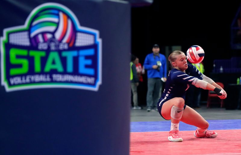 Columbus Catholic's Shelby Spata (4) bumps the ball during the WIAA Division 5 girls volleyball state championship against Eau Claire Immanuel Lutheran on Nov. 9, 2024, at the Resch Center in Ashwaubenon, Wis.