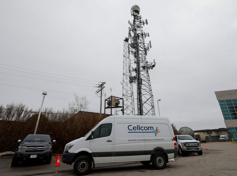 Tower climbers install cellular equipment on Tuesday, March 4, 2025, at WLUK in Ashwaubenon, Wis. The work is part of upgrades to Cellcom's existing infrastructure near Lambeau Field and the Titletown District. Cellcom additionally plans to install a new cell site on the roof of the Legacy Hotel and, for the draft surge, will deploy Cell on Wheels temporary cell sites near Lambeau.