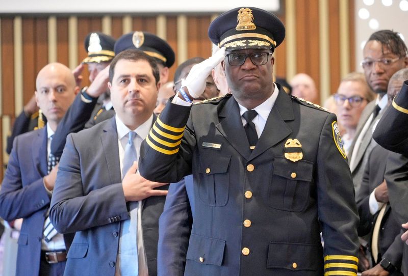 Milwaukee Police Chief Jeffrey Norman, foreground, salutes during the Greater Milwaukee Law Enforcement Memorial Ceremony at the War Memorial Center on North Lincoln Memorial Drive in Milwaukee on May 8. The event honors law enforcement officers who have lost their lives in the line of duty.